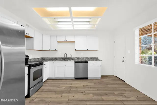 a view of an empty room with a window