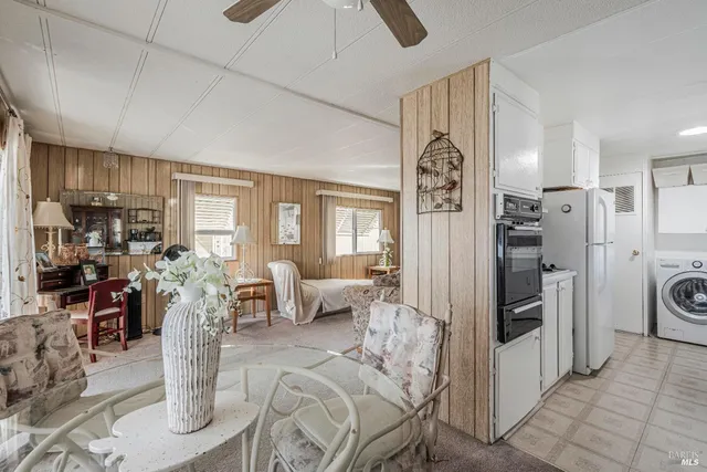 a living room with furniture a couch and a window