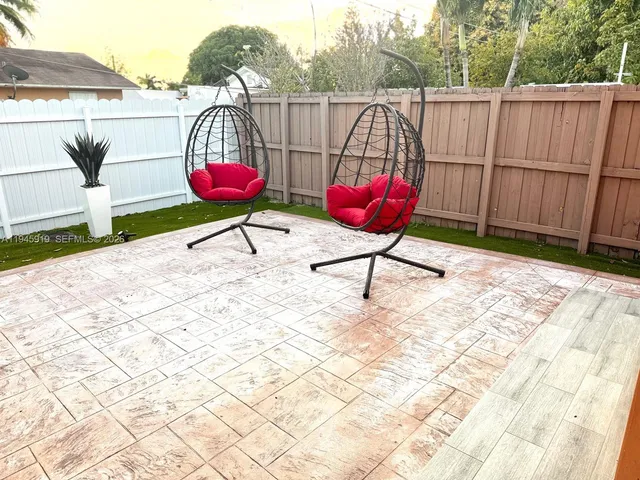 a view of a terrace with sitting area