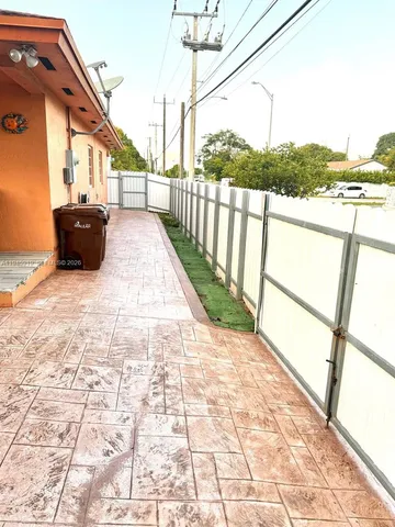 a view of a pathway with a balcony