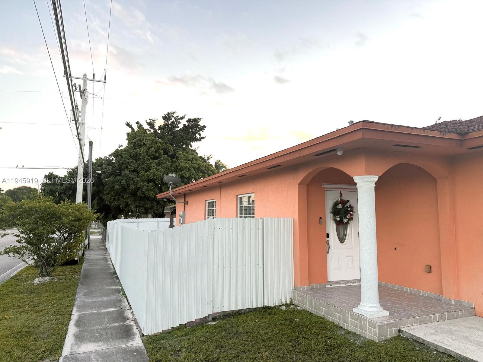 690 East 6th Place Hialeah, FL 33010 - Photo 2 of 18 a view of a house with backyard and garden