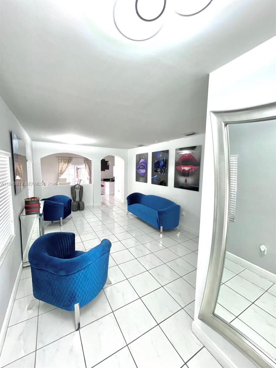 690 East 6th Place Hialeah, FL 33010 - Photo 3 of 18 a living room with furniture a rug and a window