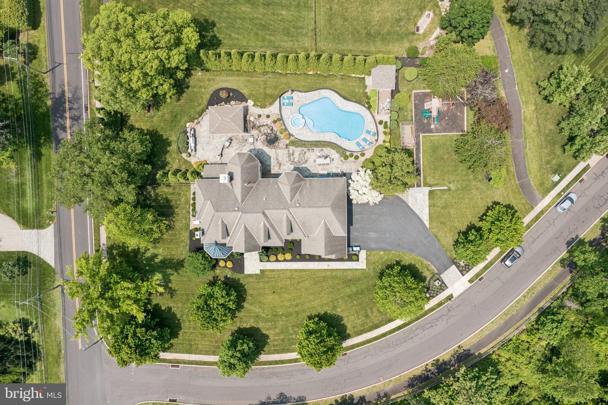 801 South Penn Oak Road Lower Gwynedd, PA 19002 - Photo 111 of 114 an aerial view of a house with a garden and yard