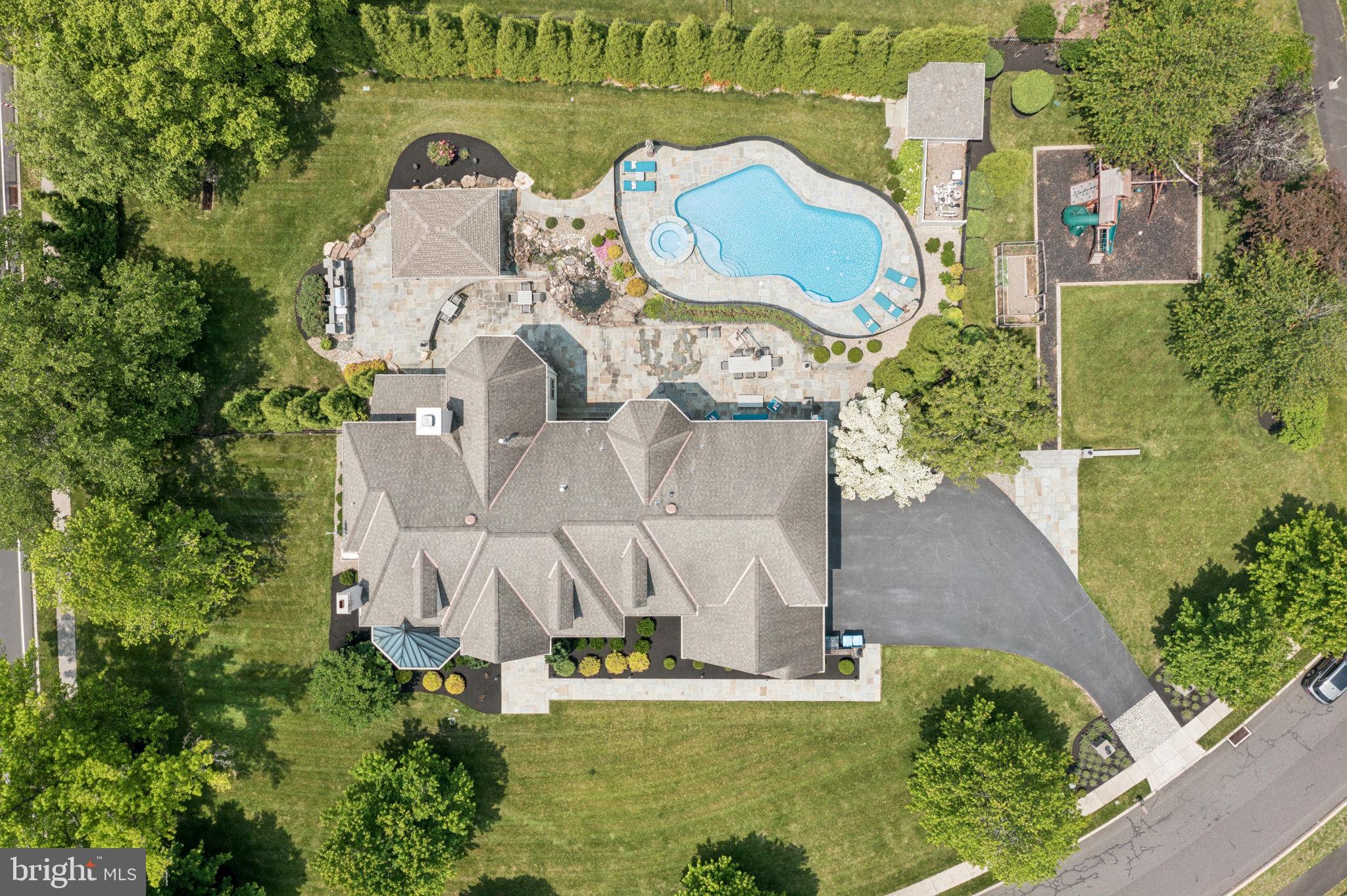 801 South Penn Oak Road Lower Gwynedd, PA 19002 - Photo 112 of 114 an aerial view of a house with swimming pool and outdoor space