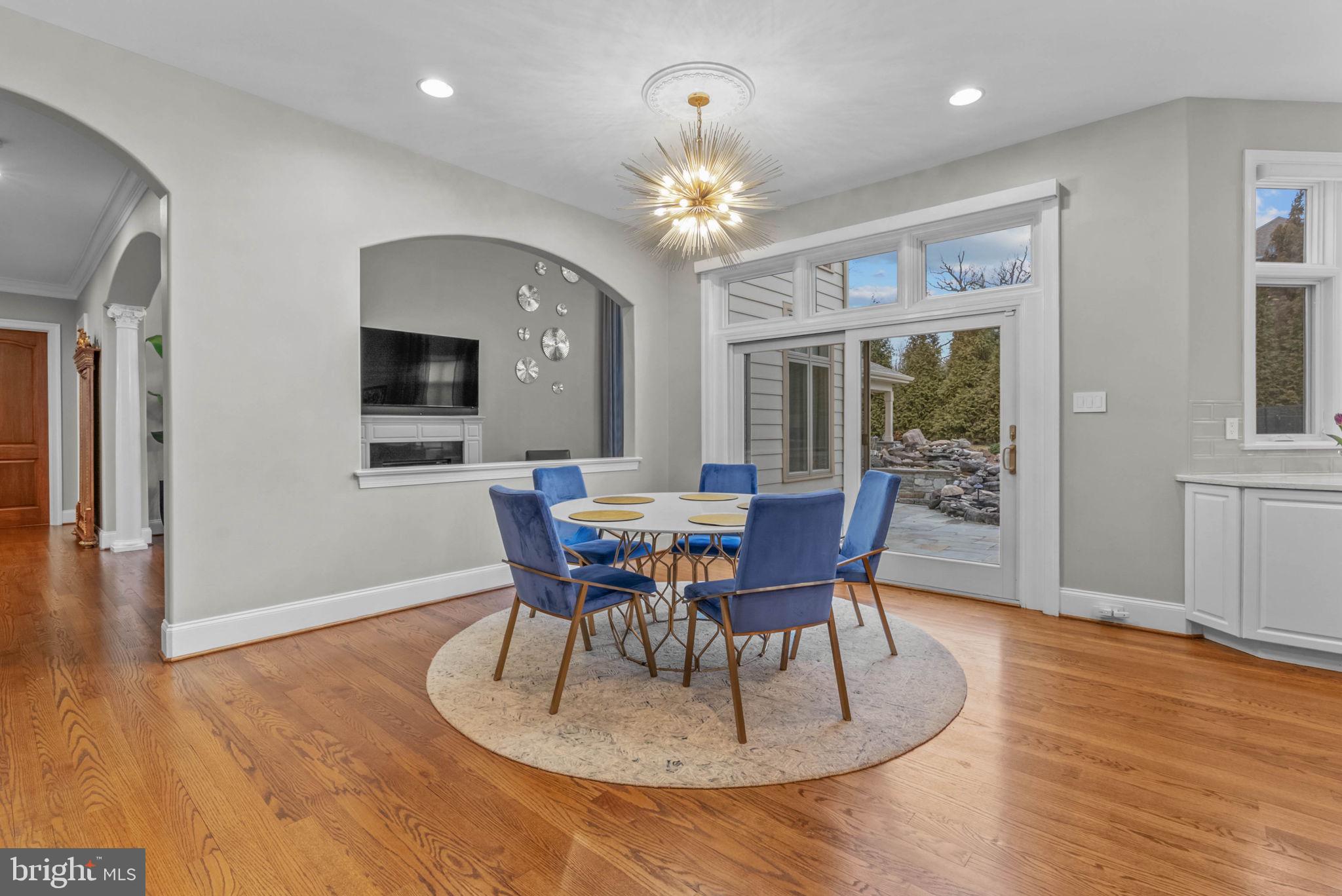 801 South Penn Oak Road Lower Gwynedd, PA 19002 - Photo 24 of 114 a view of a dining room with furniture a chandelier and wooden floor