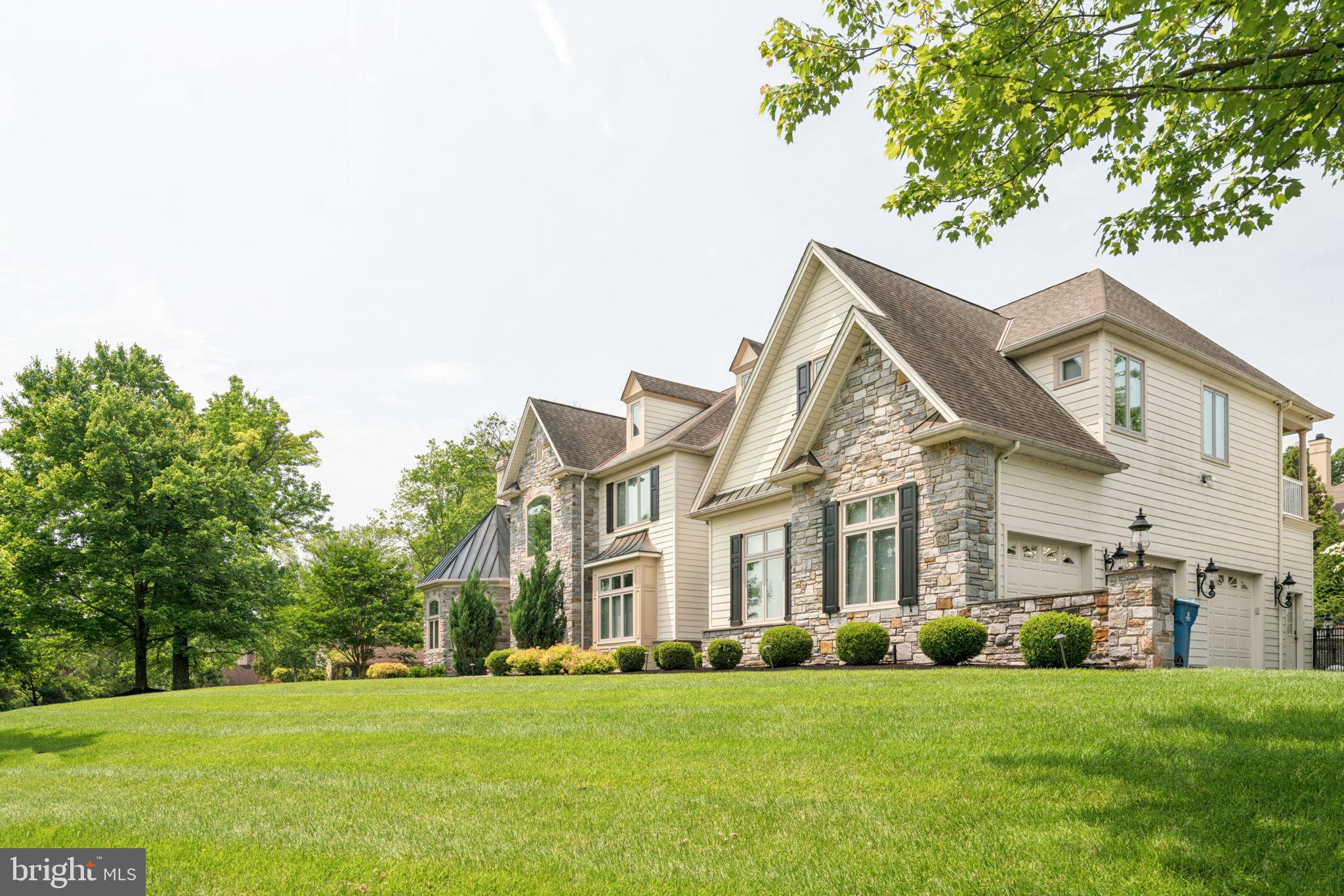801 South Penn Oak Road Lower Gwynedd, PA 19002 - Photo 4 of 114 a view of a big house with a big yard and large trees