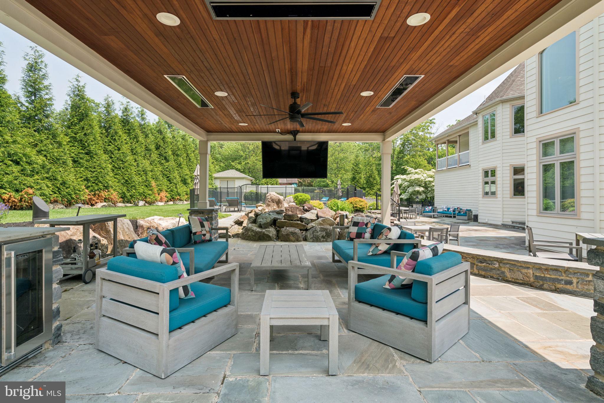 801 South Penn Oak Road Lower Gwynedd, PA 19002 - Photo 42 of 114 a outdoor living space with patio furniture and a fireplace