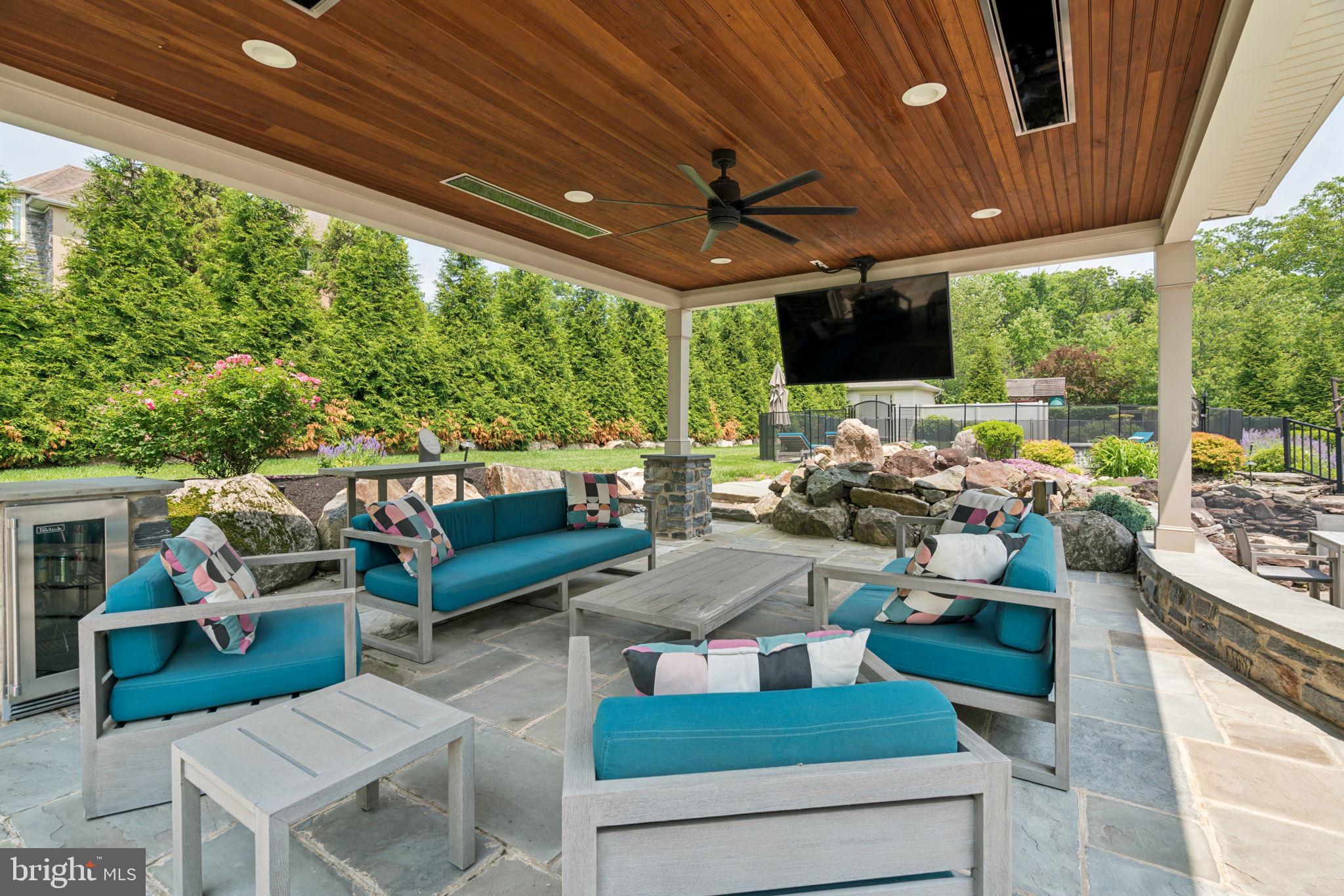 801 South Penn Oak Road Lower Gwynedd, PA 19002 - Photo 43 of 114 a view of a patio with table and chairs potted plants with floor to ceiling window