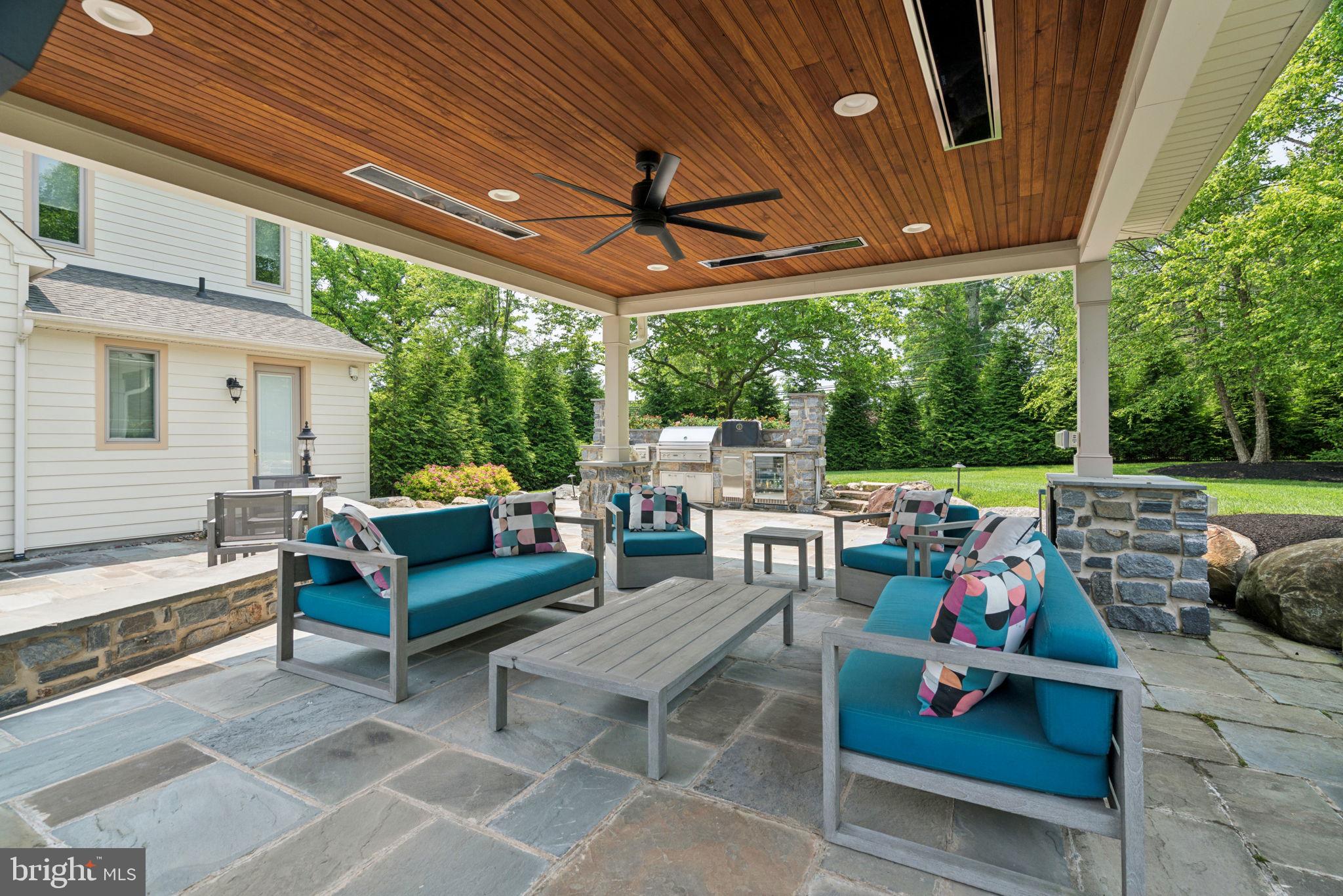 801 South Penn Oak Road Lower Gwynedd, PA 19002 - Photo 44 of 114 a outdoor space with patio the couches and a dining table with garden view
