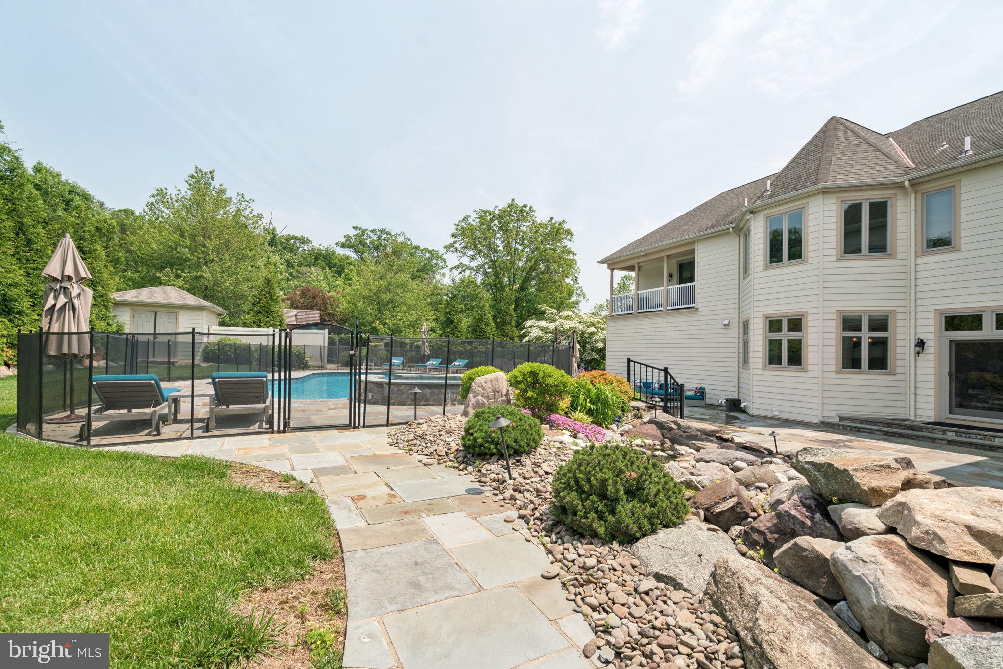 801 South Penn Oak Road Lower Gwynedd, PA 19002 - Photo 46 of 114 a view of a house with backyard sitting area and garden