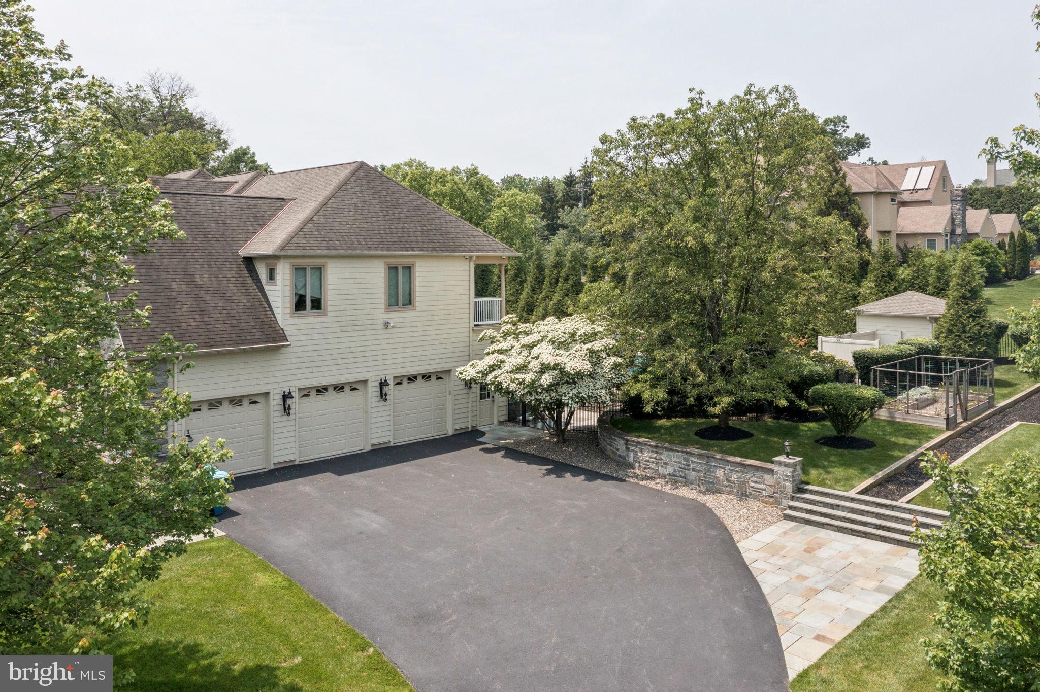 801 South Penn Oak Road Lower Gwynedd, PA 19002 - Photo 5 of 114 a view of a house with a yard and potted plants