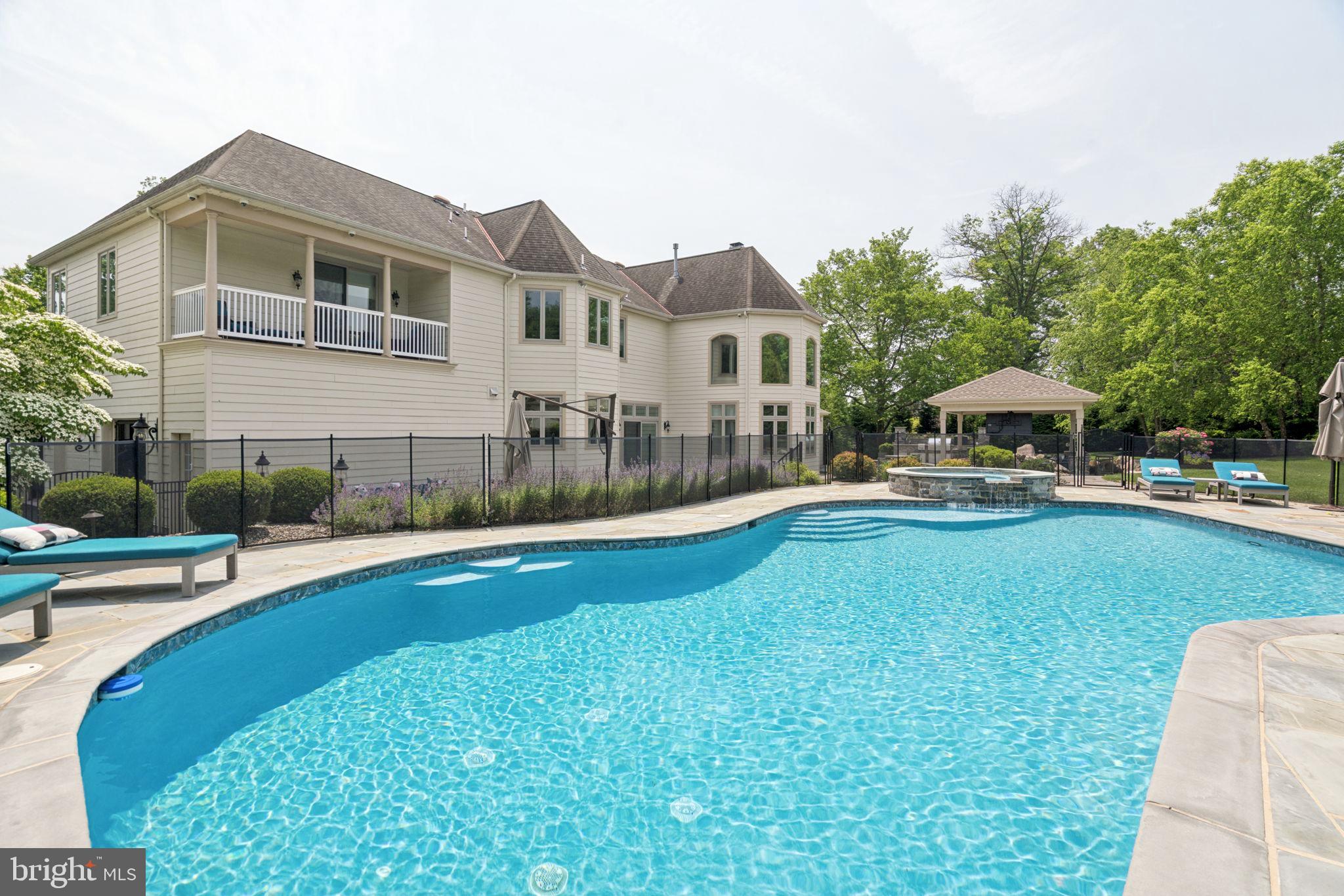 801 South Penn Oak Road Lower Gwynedd, PA 19002 - Photo 51 of 114 a view of a house with a swimming pool