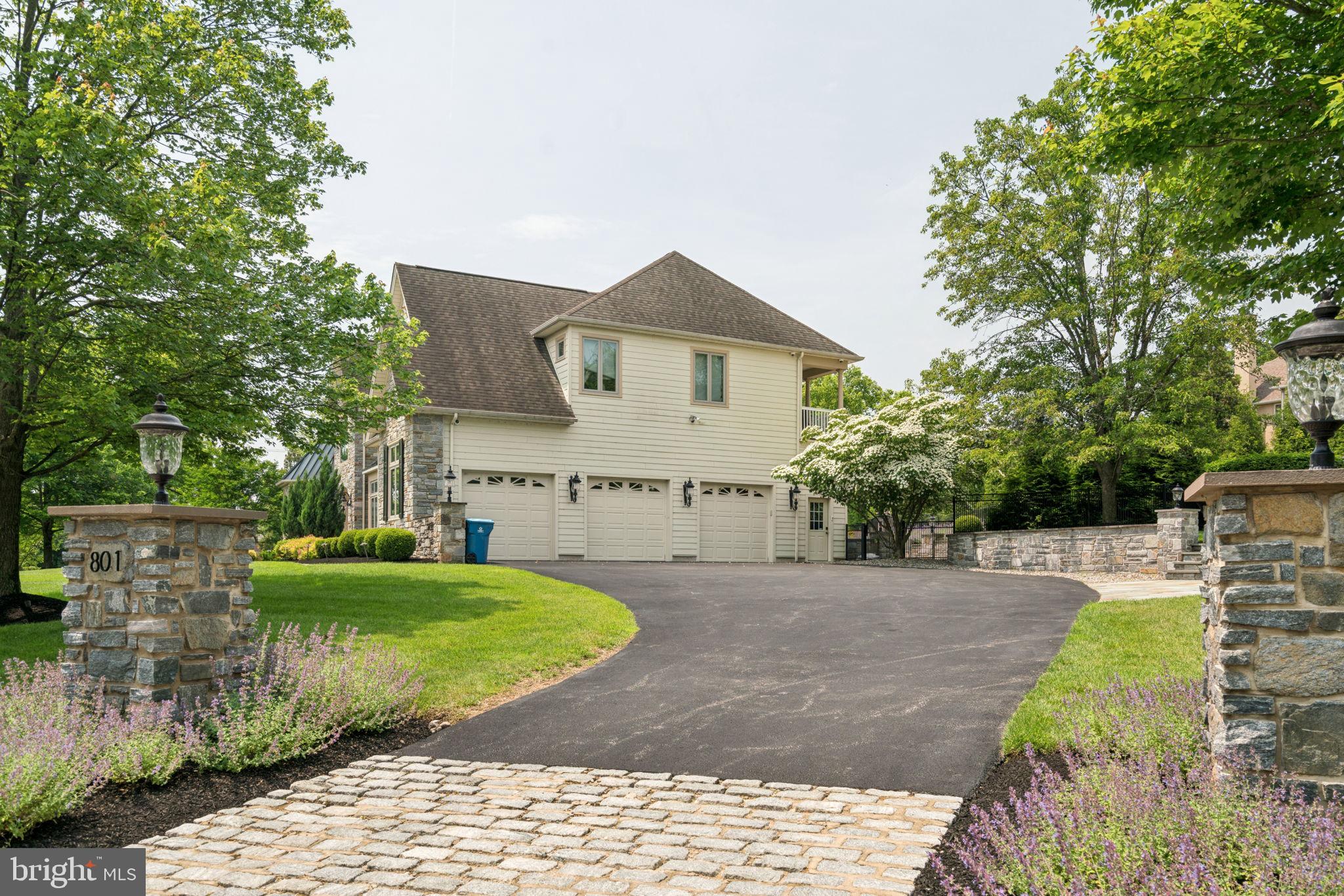 801 South Penn Oak Road Lower Gwynedd, PA 19002 - Photo 8 of 114 a front view of a house with a yard and trees