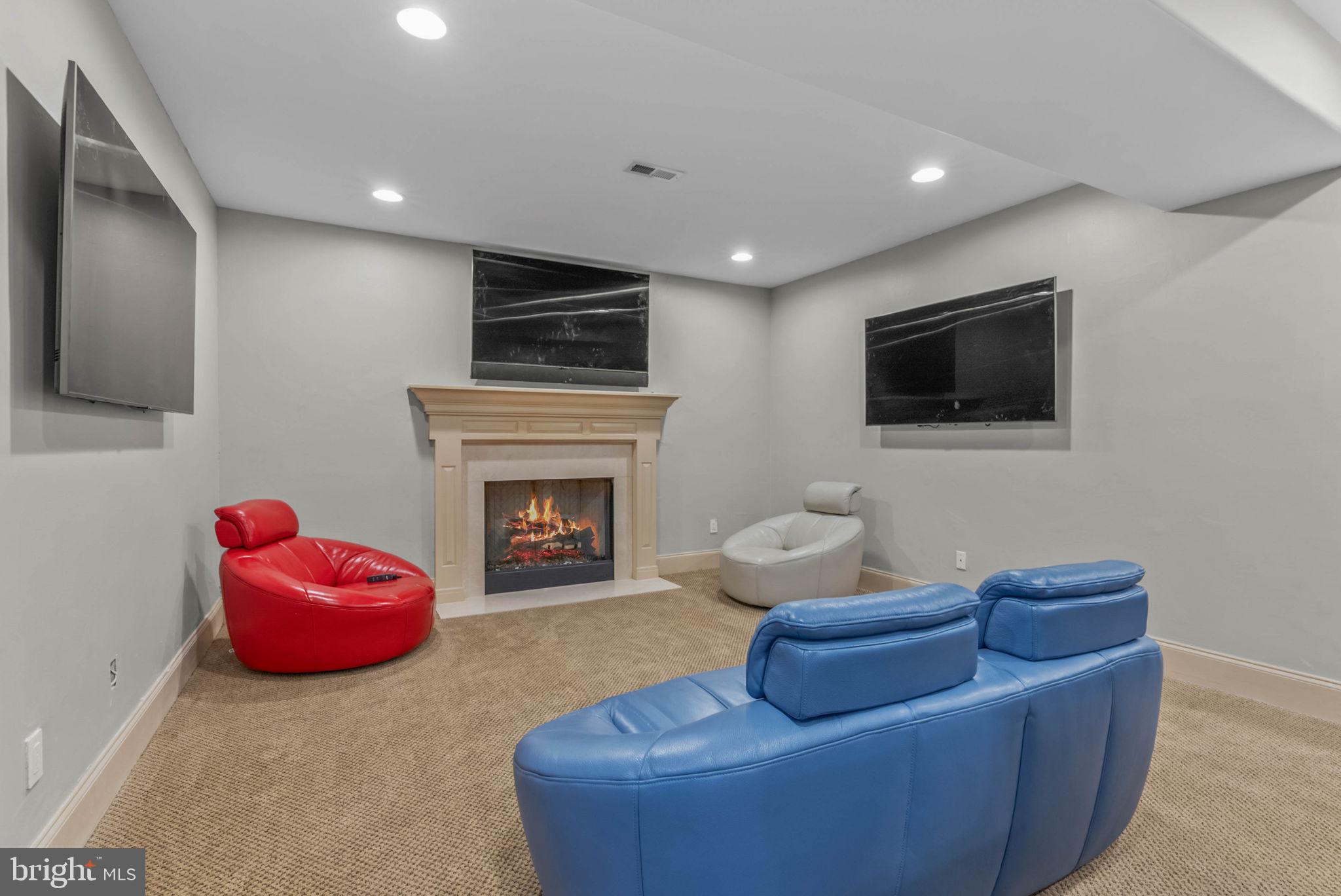 801 South Penn Oak Road Lower Gwynedd, PA 19002 - Photo 85 of 114 a living room with furniture a flat screen tv and a fireplace