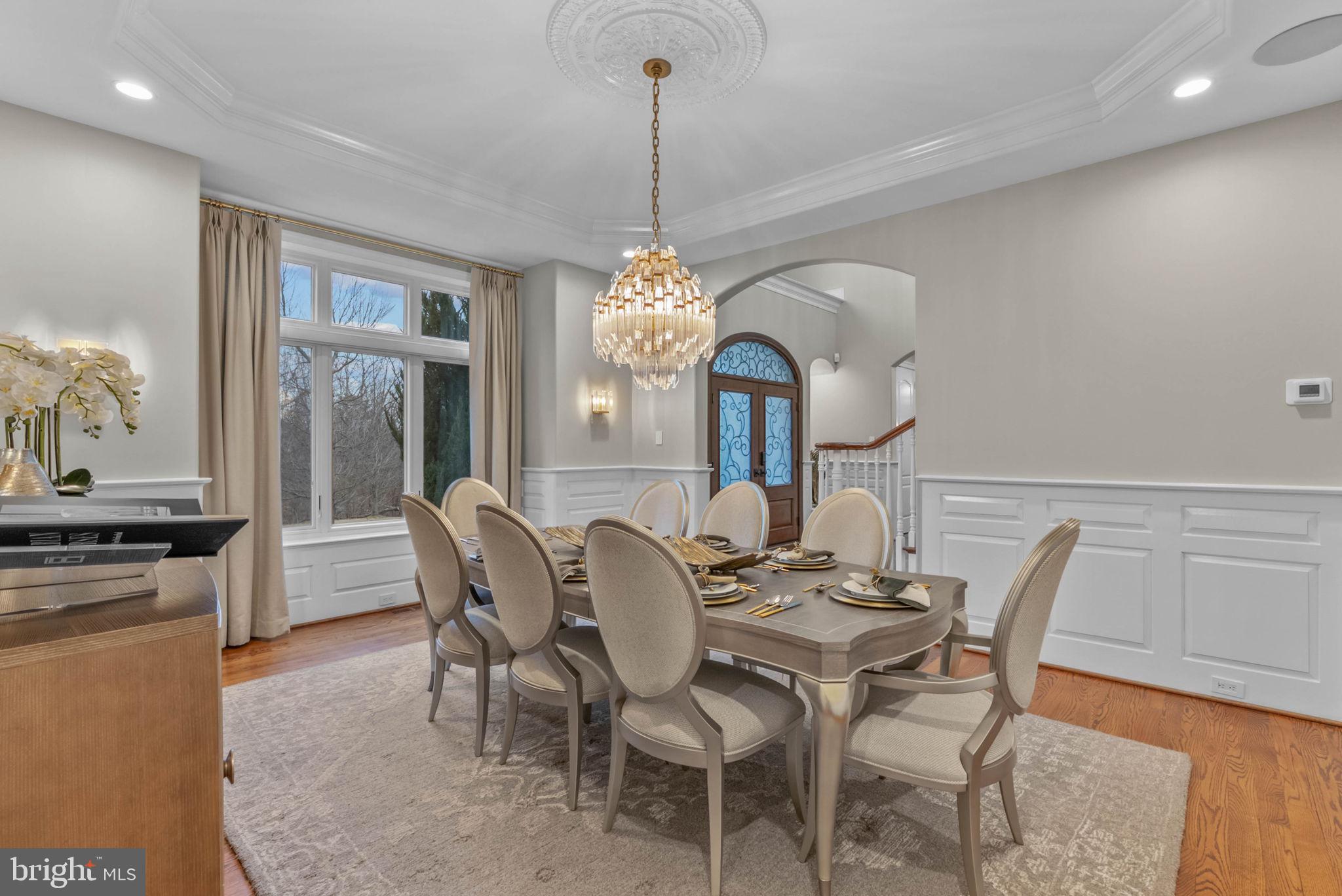 801 South Penn Oak Road Lower Gwynedd, PA 19002 - Photo 10 of 29 a dining room with furniture a chandelier and window