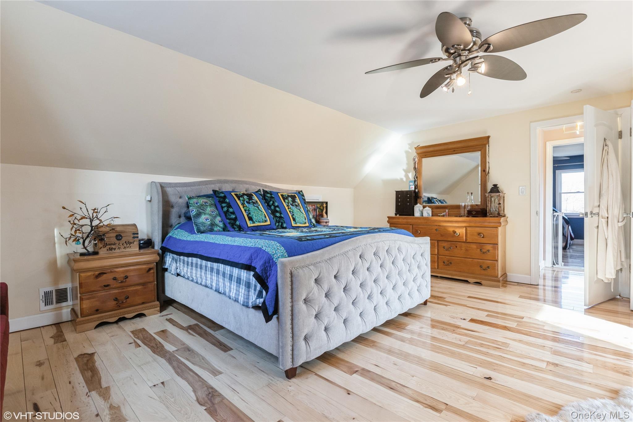 289 Quaker Road Pomona, NY 10970 - Photo 16 of 30 a bedroom with a bed and a chandelier