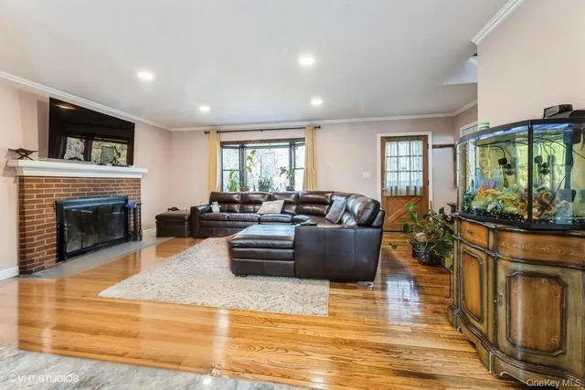 a living room with granite countertop furniture and a dining room
