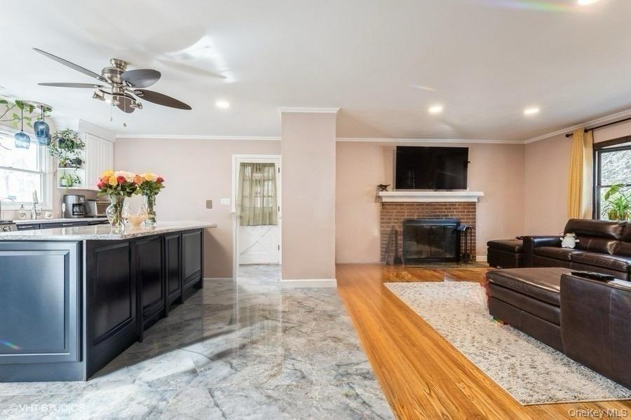 289 Quaker Road Pomona, NY 10970 - Photo 7 of 30 a living room with furniture a fireplace and a flat screen tv