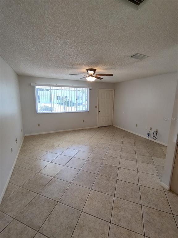 8491 Southwest 109th Street Ocala, FL 34481 - Photo 13 of 39 a view of an empty room with a window