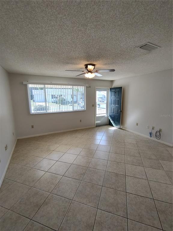 8491 Southwest 109th Street Ocala, FL 34481 - Photo 14 of 39 a view of an empty room with a window
