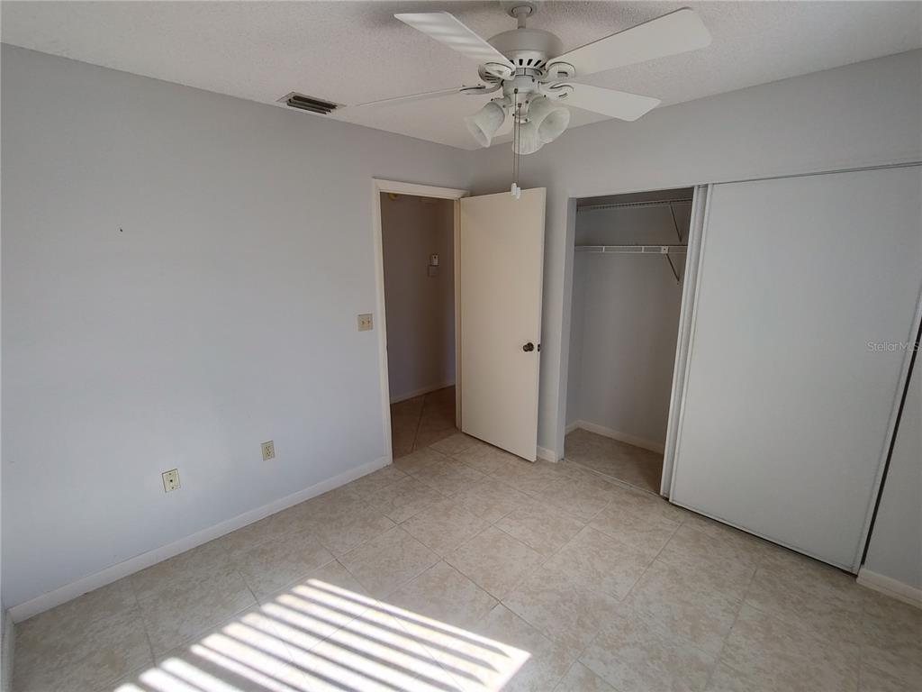 8491 Southwest 109th Street Ocala, FL 34481 - Photo 15 of 39 a view of an empty room with a window
