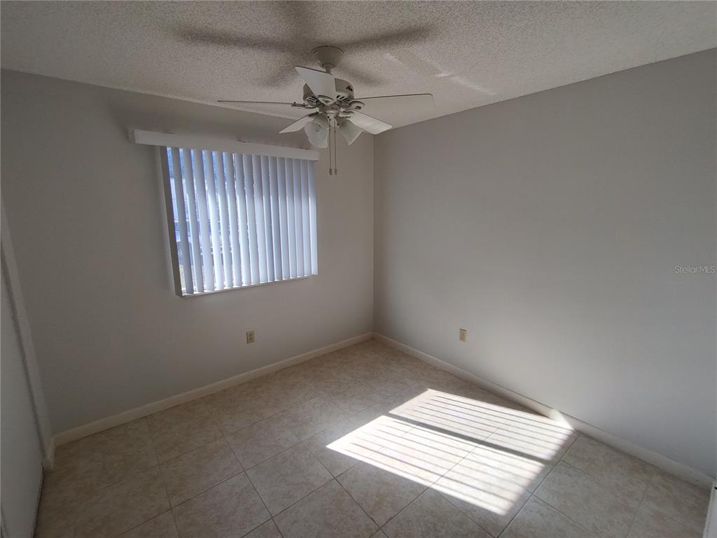 8491 Southwest 109th Street Ocala, FL 34481 - Photo 16 of 39 an empty room with windows