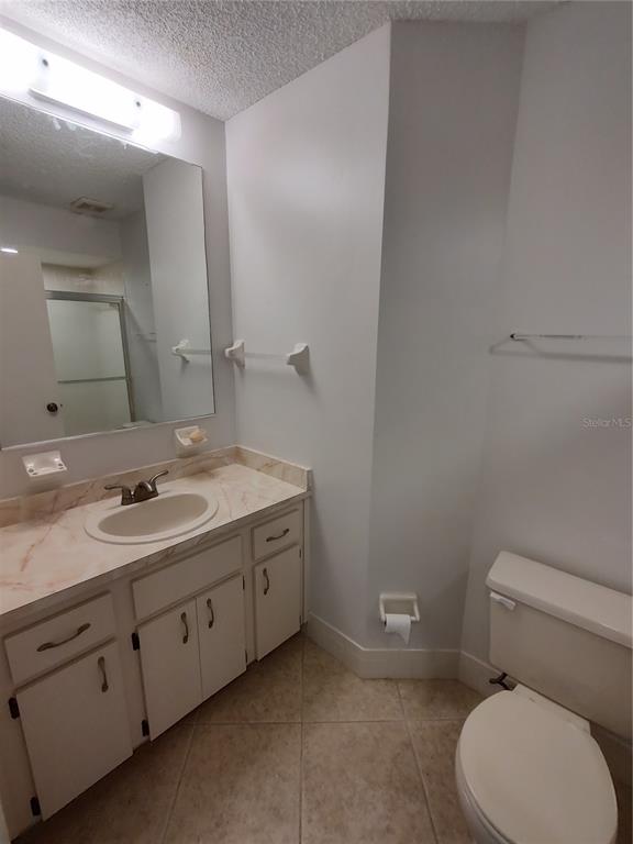 8491 Southwest 109th Street Ocala, FL 34481 - Photo 18 of 39 a bathroom with a toilet sink and mirror