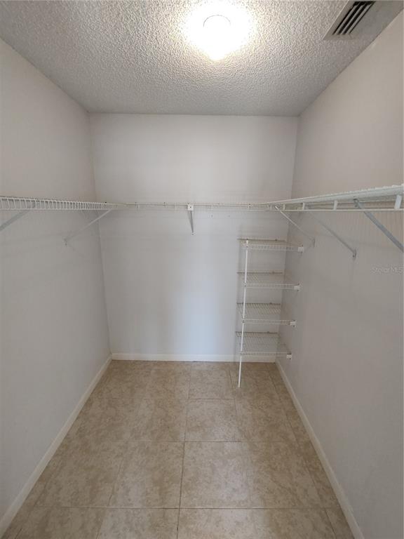 8491 Southwest 109th Street Ocala, FL 34481 - Photo 24 of 39 a view of a room with racks on the wall