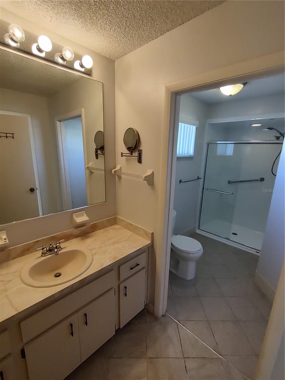 8491 Southwest 109th Street Ocala, FL 34481 - Photo 29 of 39 a bathroom with a toilet sink and mirror