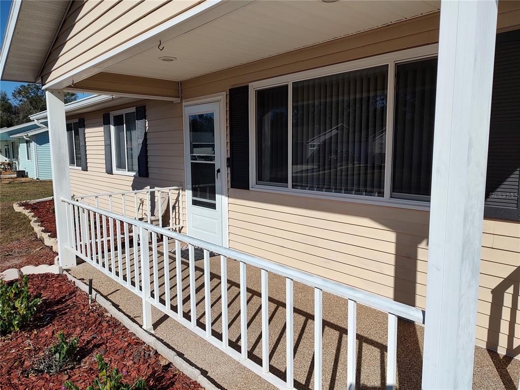 8491 Southwest 109th Street Ocala, FL 34481 - Photo 3 of 39 a view of a house with wooden floor