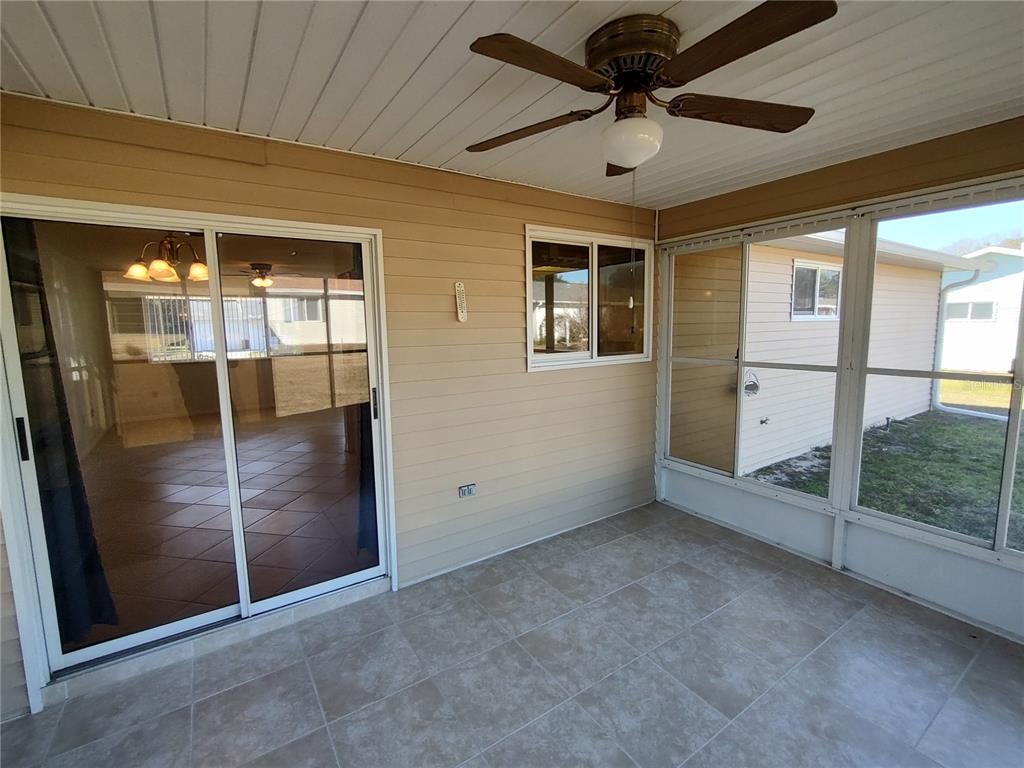 8491 Southwest 109th Street Ocala, FL 34481 - Photo 32 of 39 an empty room with fan and windows