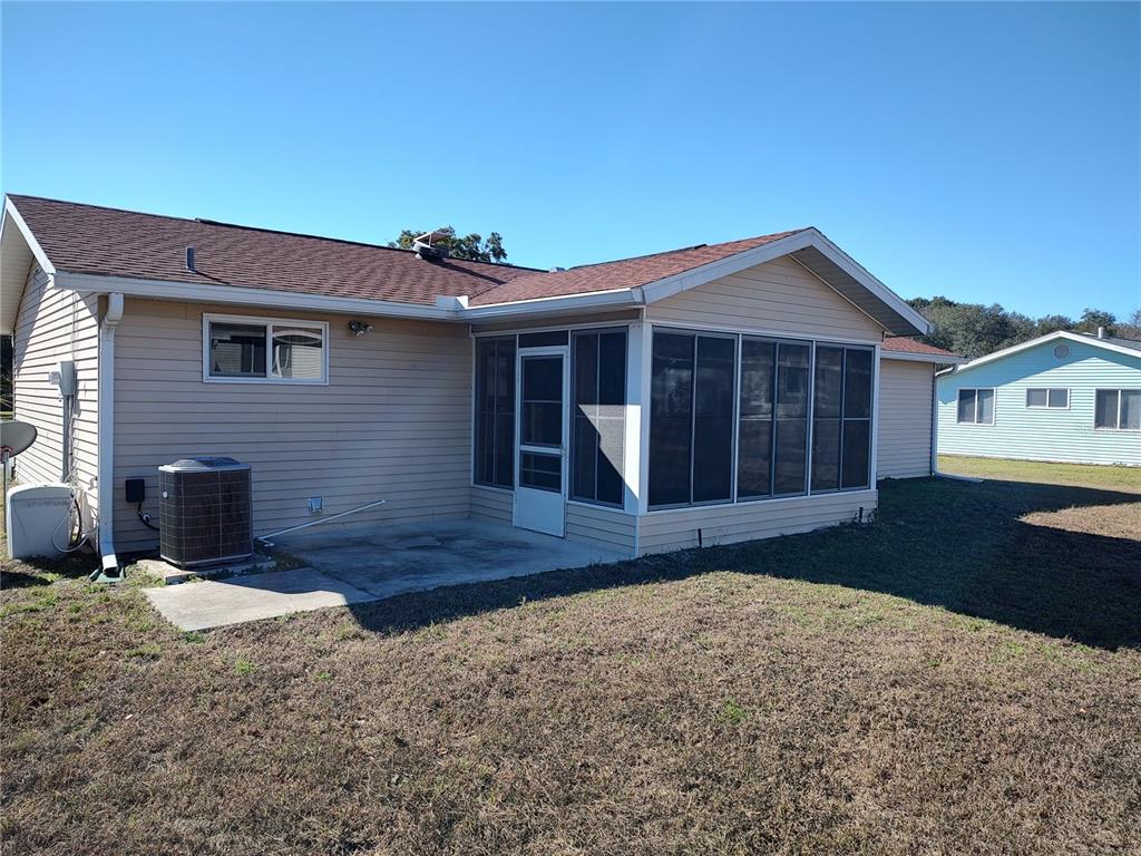 8491 Southwest 109th Street Ocala, FL 34481 - Photo 35 of 39 a front view of a house with a yard and garage