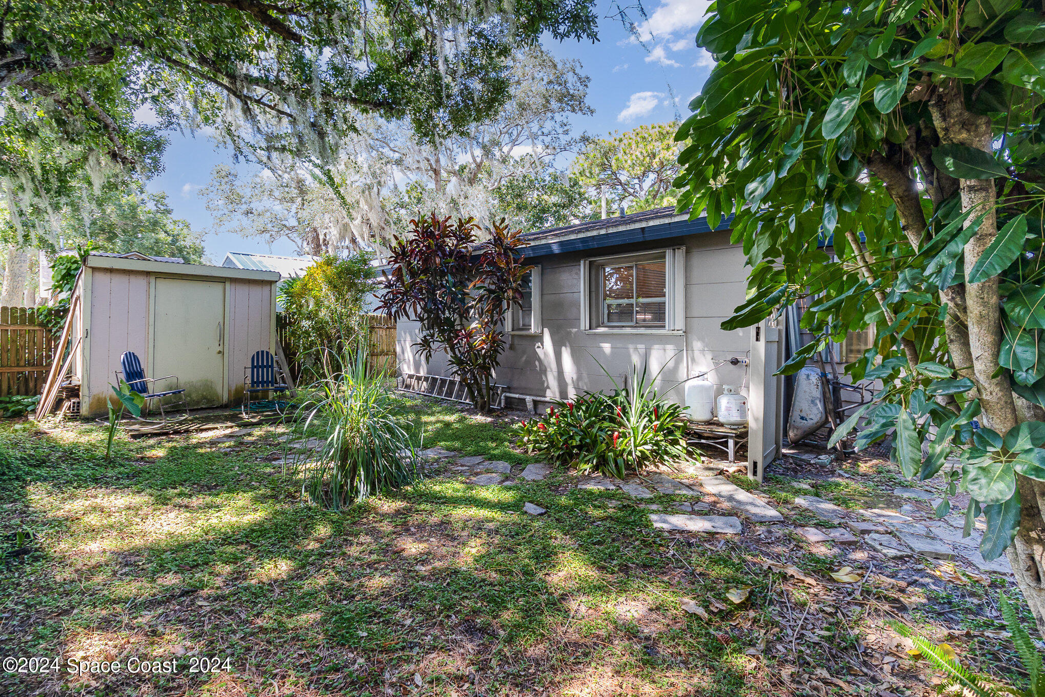 1707 Platt Street Melbourne, FL 32901 - Photo 20 of 32 a view of a house with a yard and plants
