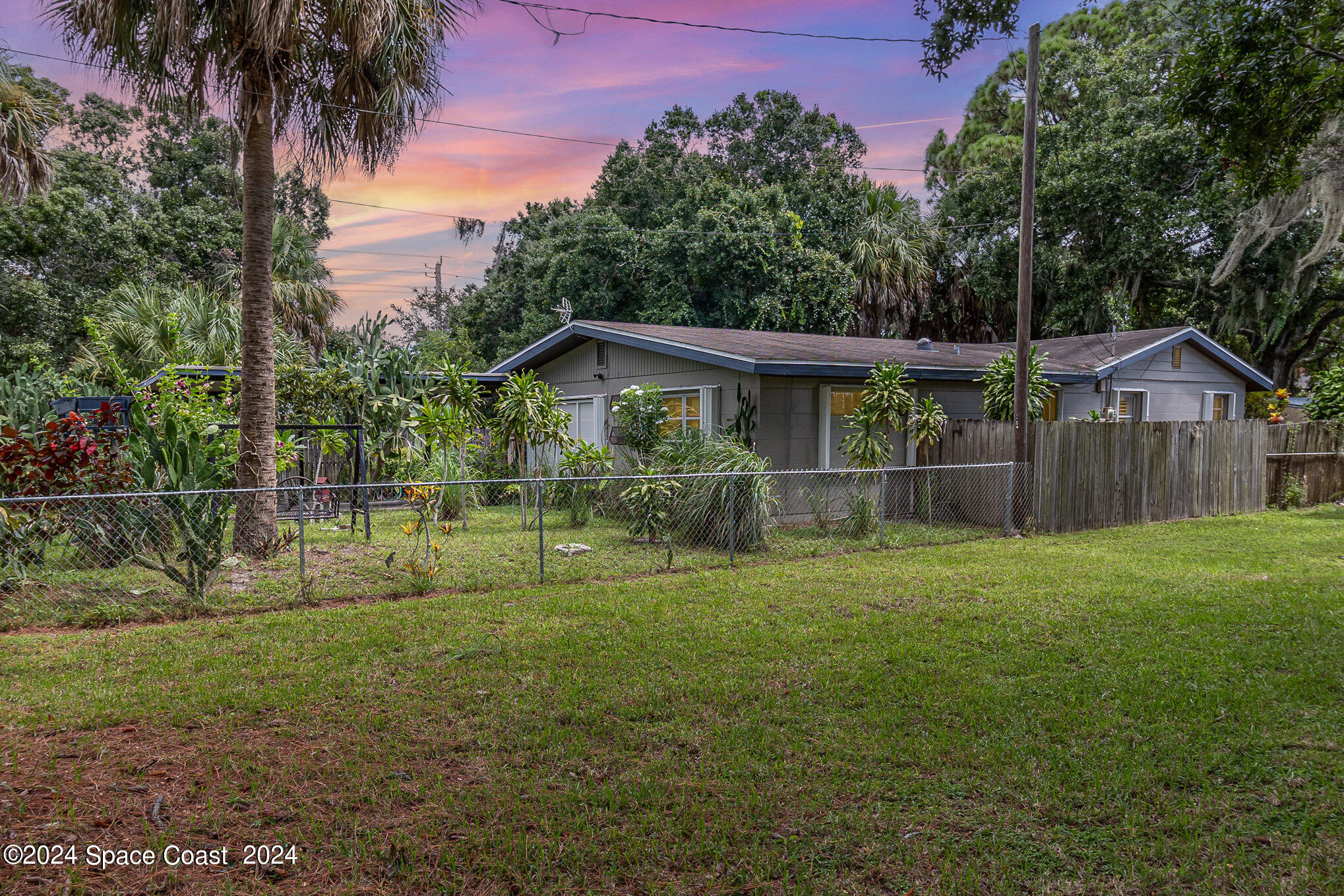 1707 Platt Street Melbourne, FL 32901 - Photo 23 of 32 a view of a house with yard and a garden