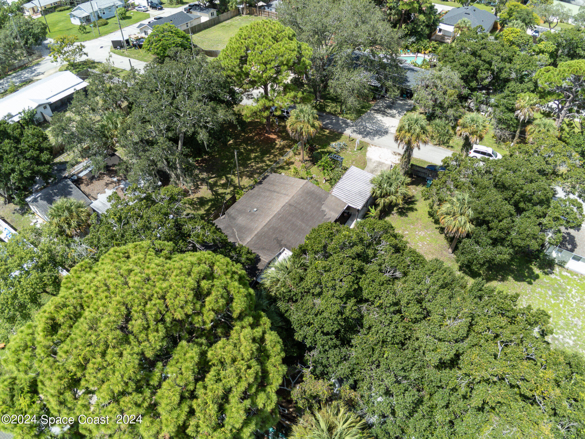 1707 Platt Street Melbourne, FL 32901 - Photo 25 of 32 an aerial view of residential house with outdoor space and trees all around