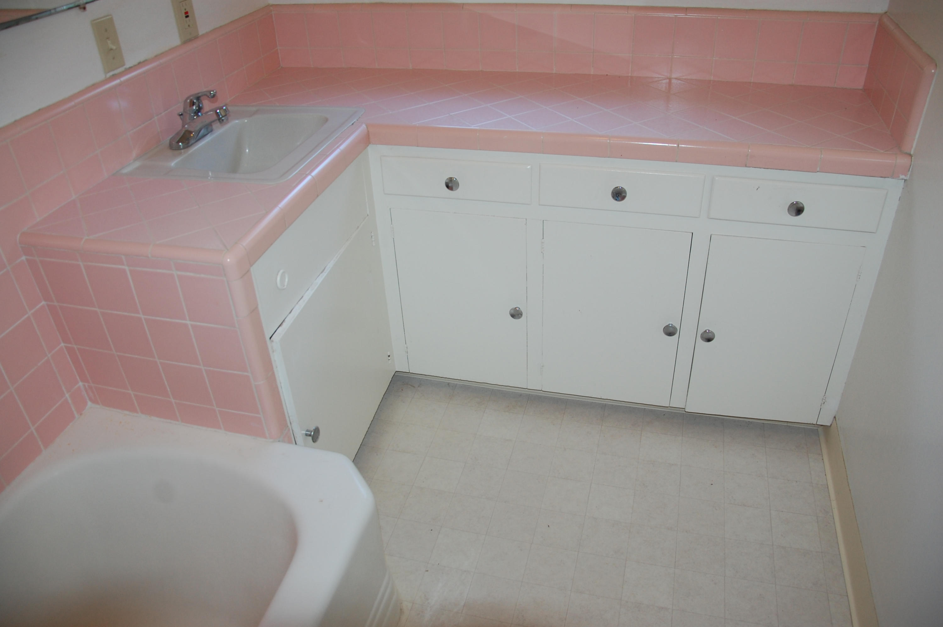 3933 Foothill Road Santa Barbara, CA 93110 - Photo 14 of 28 a bathroom with a sink and vanity