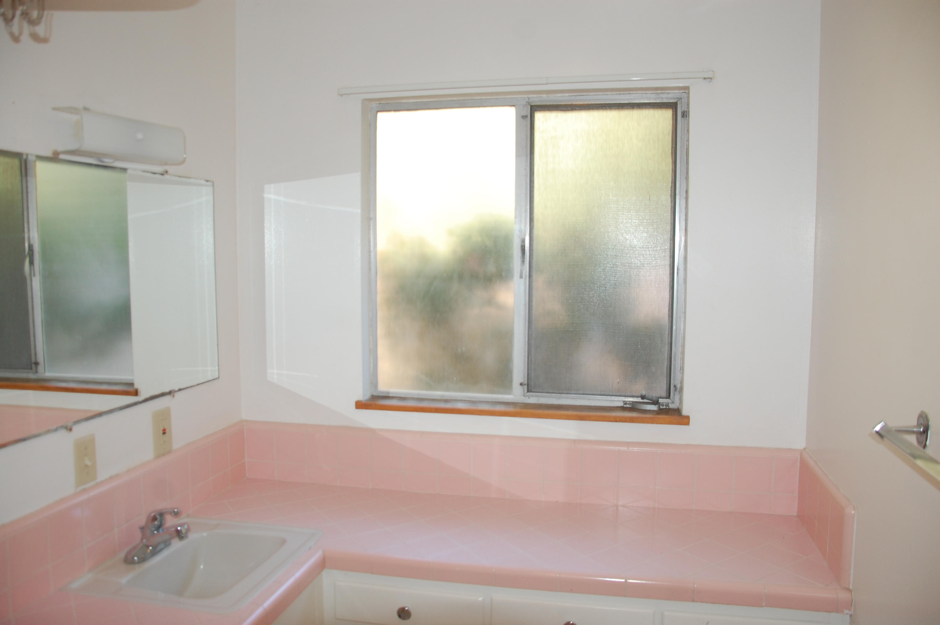 3933 Foothill Road Santa Barbara, CA 93110 - Photo 15 of 28 a bathroom with a sink and a mirror