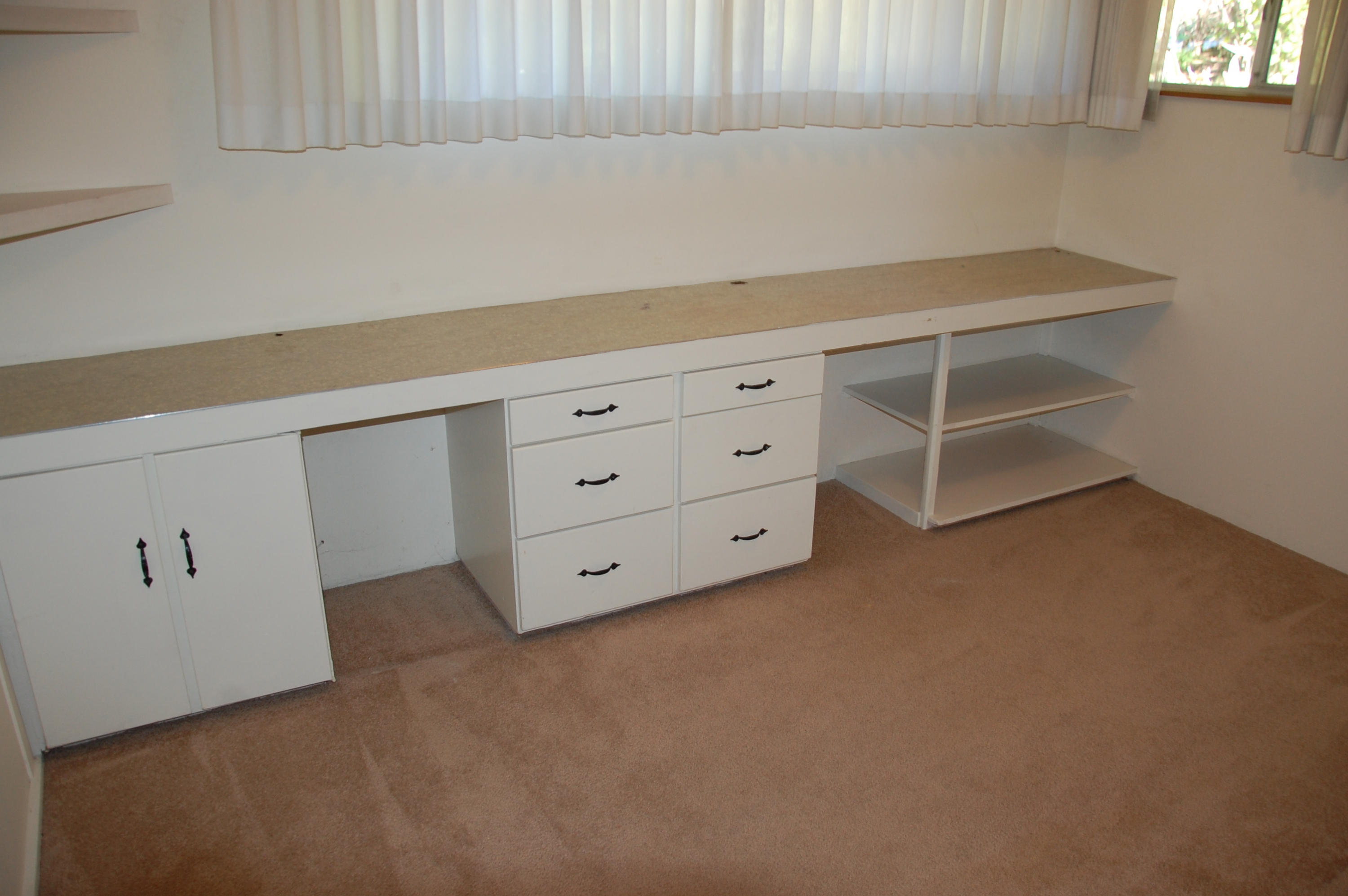 3933 Foothill Road Santa Barbara, CA 93110 - Photo 17 of 28 a room with a cabinets and a window