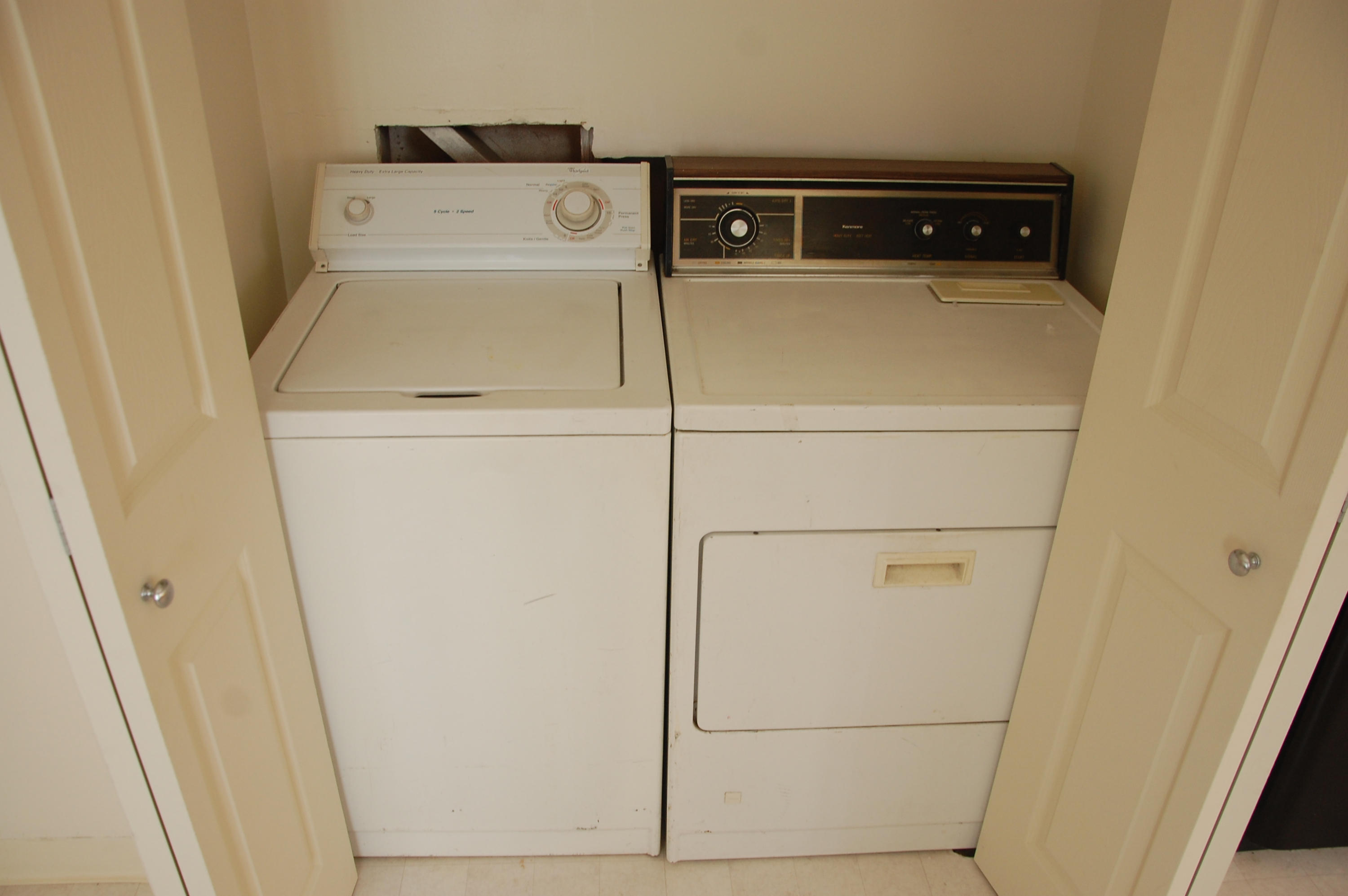 3933 Foothill Road Santa Barbara, CA 93110 - Photo 24 of 28 a utility room with dryer and washer