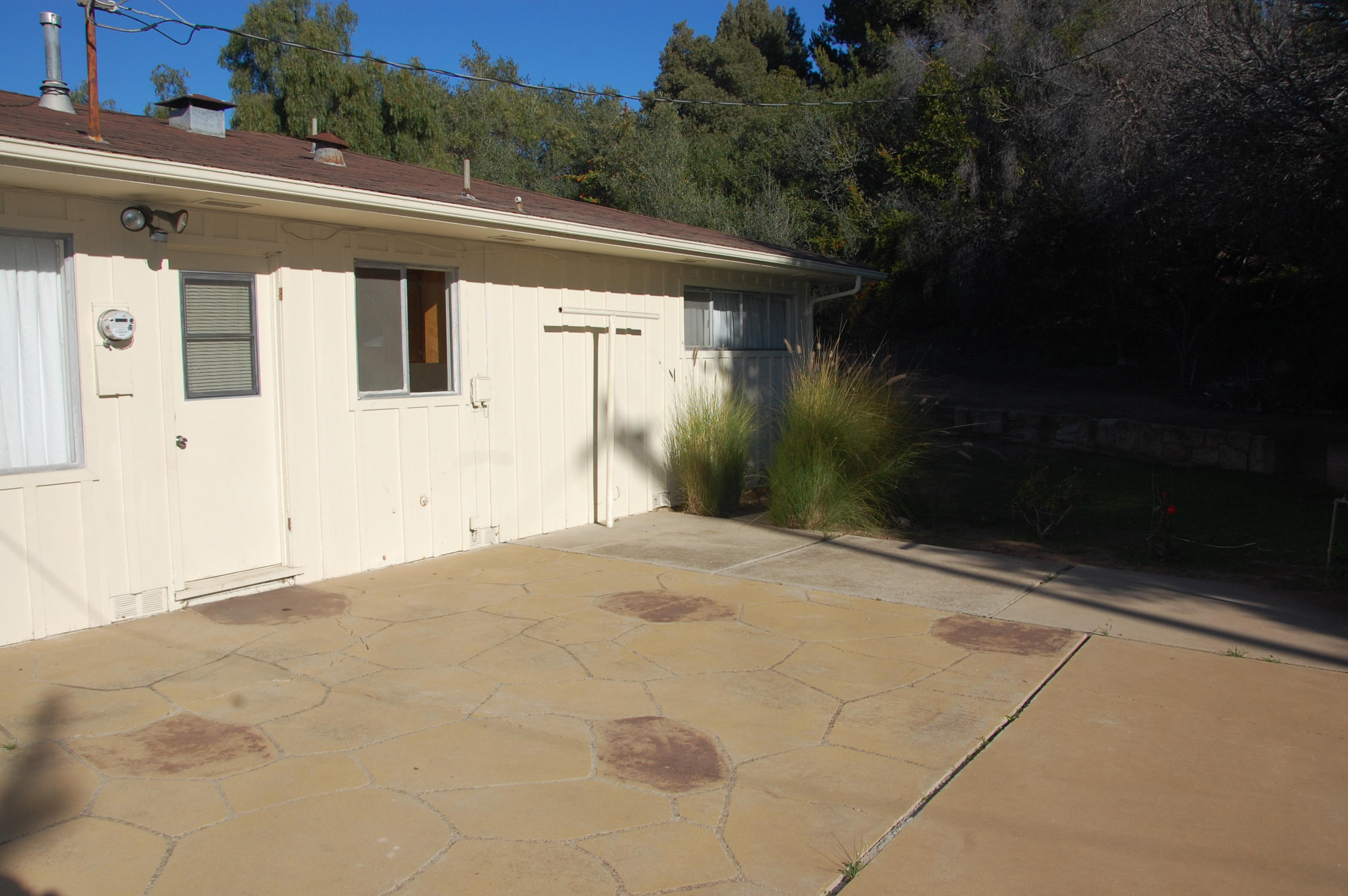 3933 Foothill Road Santa Barbara, CA 93110 - Photo 3 of 28 a view of a house with backyard and trees