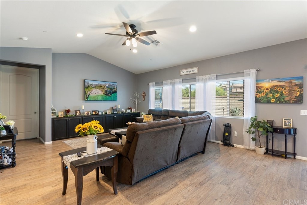 24802 Sandy Trail Place Menifee, CA 92584 - Photo 19 of 42 a living room with furniture and wooden floor