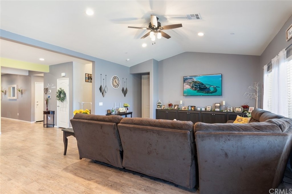 24802 Sandy Trail Place Menifee, CA 92584 - Photo 20 of 42 a living room with furniture and a flat screen tv
