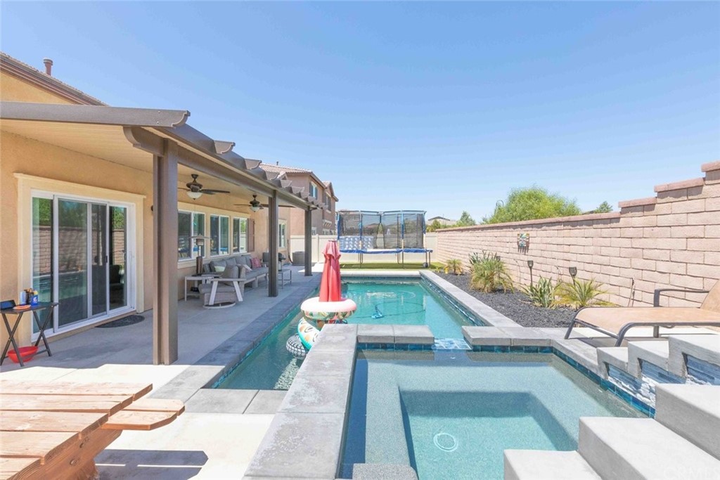 24802 Sandy Trail Place Menifee, CA 92584 - Photo 30 of 42 a view of balcony with couch and chairs