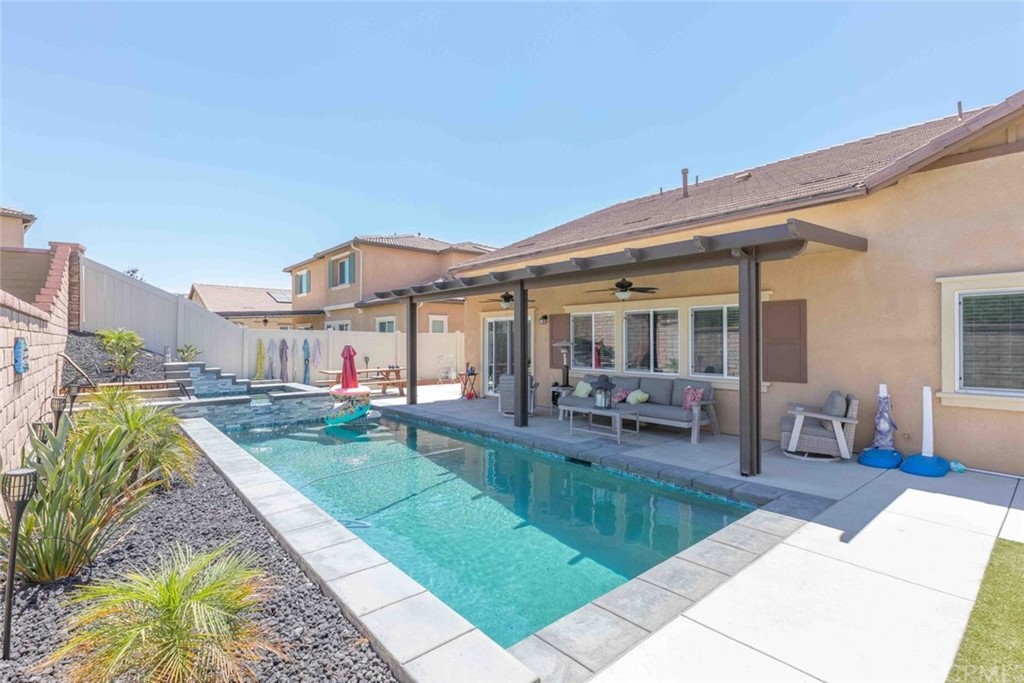 24802 Sandy Trail Place Menifee, CA 92584 - Photo 32 of 42 a view of a house with swimming pool and sitting area
