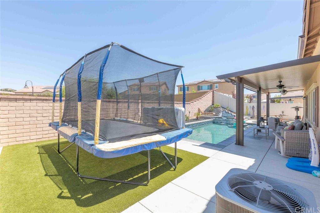 24802 Sandy Trail Place Menifee, CA 92584 - Photo 34 of 42 a building outdoor space with patio furniture