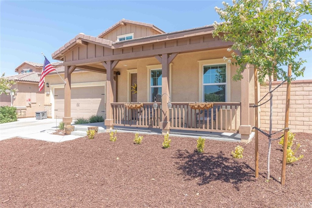 24802 Sandy Trail Place Menifee, CA 92584 - Photo 8 of 42 a backyard of a house with table and chairs
