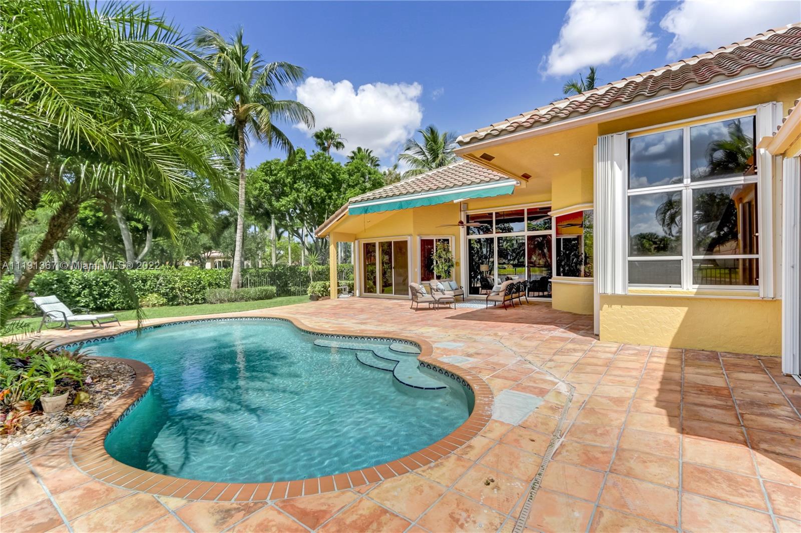 300 Mallard Road Weston, FL 33327 - Photo 12 of 46 a view of a house with swimming pool and sitting area