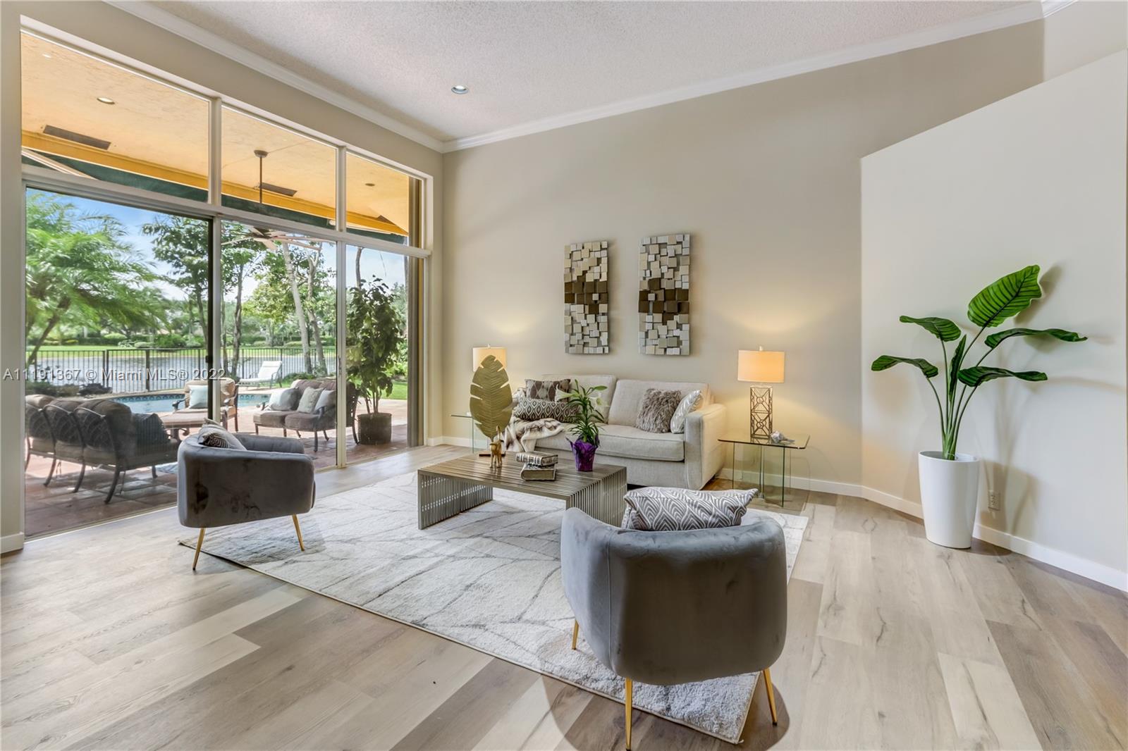 300 Mallard Road Weston, FL 33327 - Photo 14 of 46 a living room with furniture large window and a potted plant