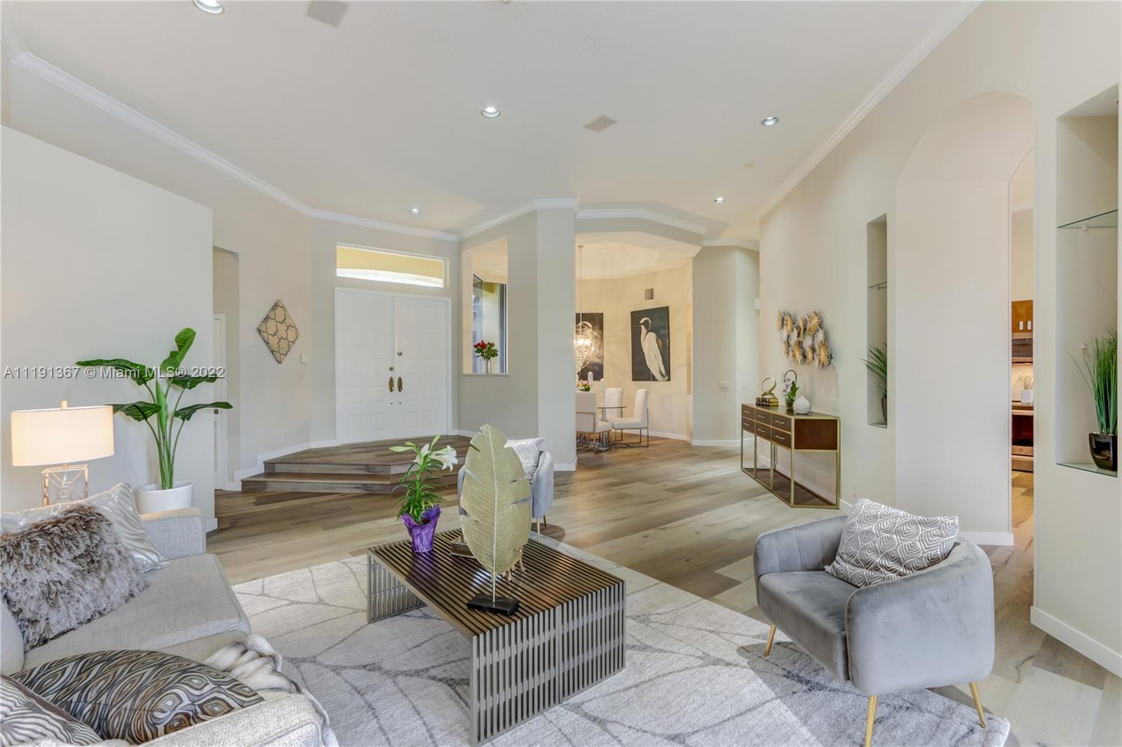 300 Mallard Road Weston, FL 33327 - Photo 16 of 46 a living room with furniture and a potted plant