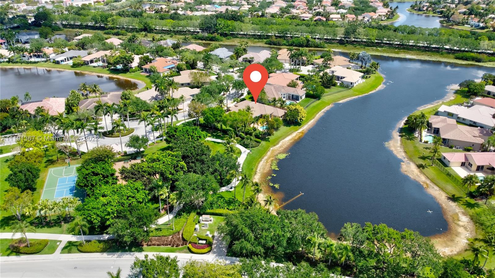 300 Mallard Road Weston, FL 33327 - Photo 2 of 46 an aerial view of a house with a yard and lake view